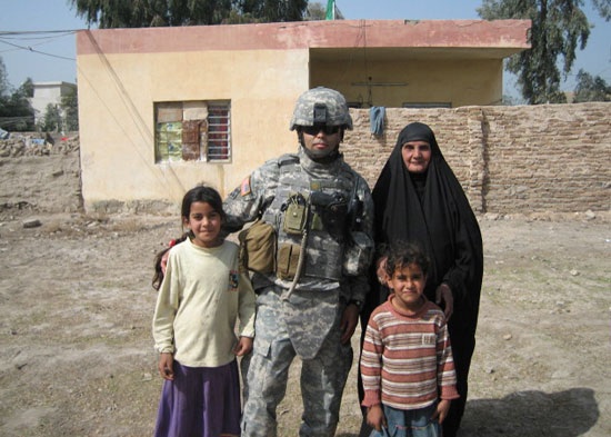 Yebra with a family in front of a school