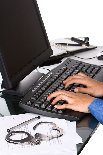 police typing on computer