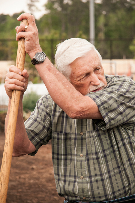 "Volunteer working at Veggie Village" by Casey Mills