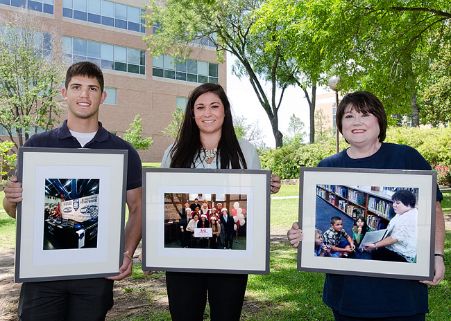 winners posing with their photos