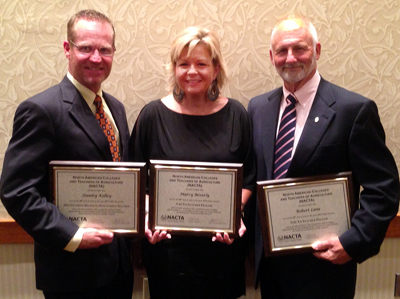 Professors Kelley, Beverly, and Lane holding their award certificates