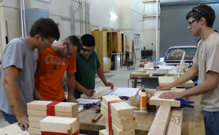 student working together to build a robot