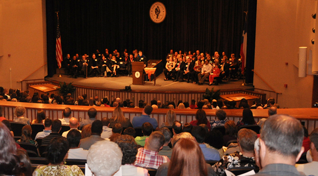 students on stage during the College of Criminal Justice Honors Convocation