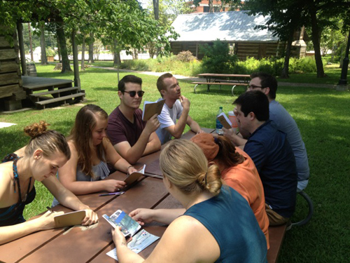 students on Sam Houston Memorial Museum grounds taking notes and thinking