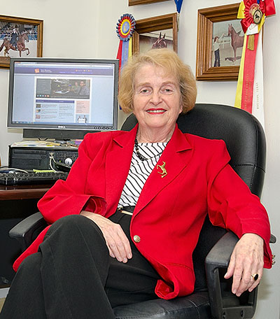 Mary Alice Conroy sitting at her desk