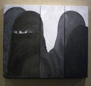 several women wearing burkas with one woman's eyes barely visible and gazing intensly