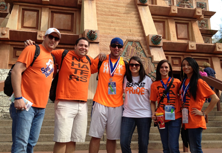 students and staff posing in their Bearkat orange shirts outside the competition building