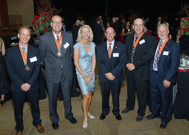 University President Hoyt and Provost Hebert with Faculty Excellence Award recipients at awards dinner