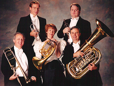 faculty brass quintet posing with instruments