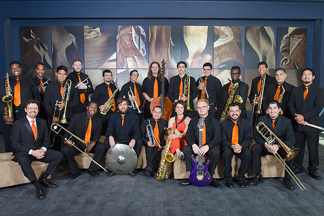 SHSU Jazz Ensemble posing with their instruments in the Performing Arts Center