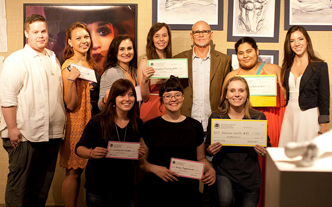 participamts and winners pose in the gallery after the show with guest juror