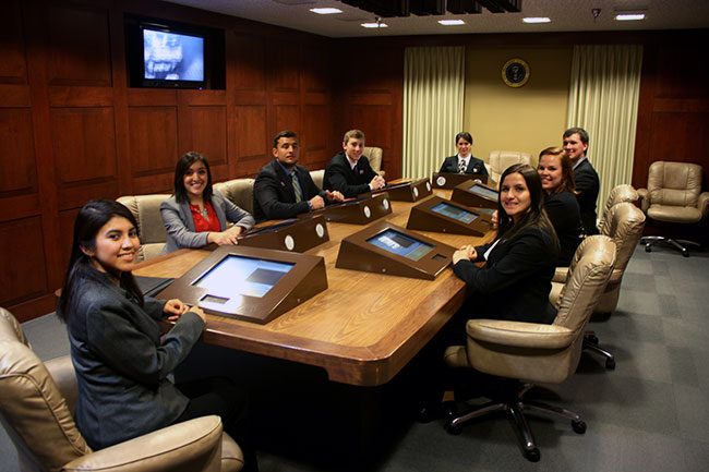 LEAP students sitting around the table in the George W. Bush Presidential Library's Situation Room