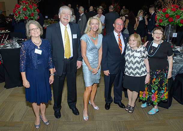 University President Hoyt and Provost Hebert with Retirees at awards dinner