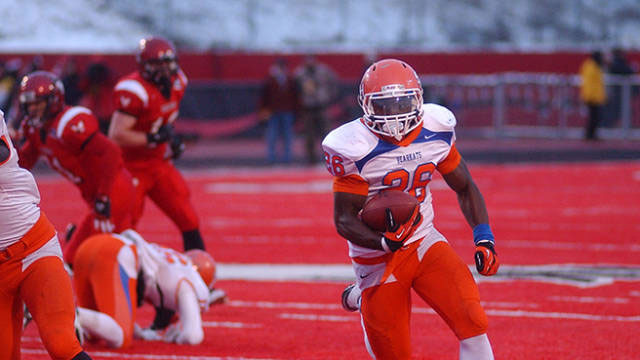 Bearkat football player running with the football