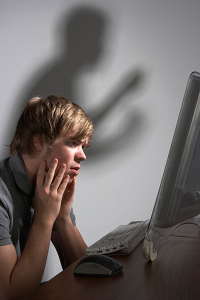 young man sitting at a computer
