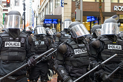 group of police dressed in riot gear