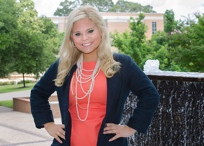 Alexis Bloomer in front of fountain on campus