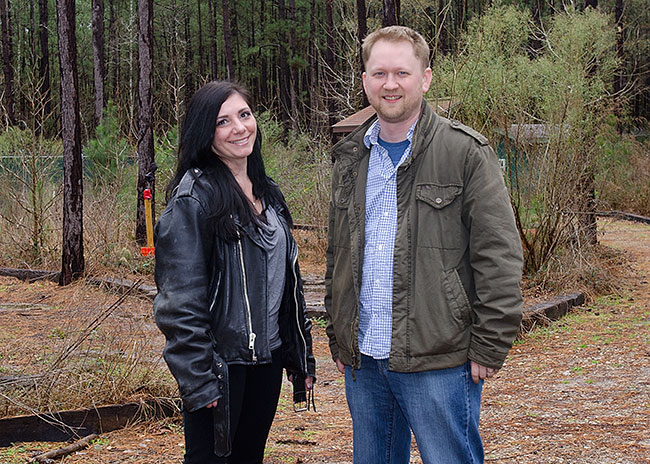 Bucheli and Lynne posing in the woods