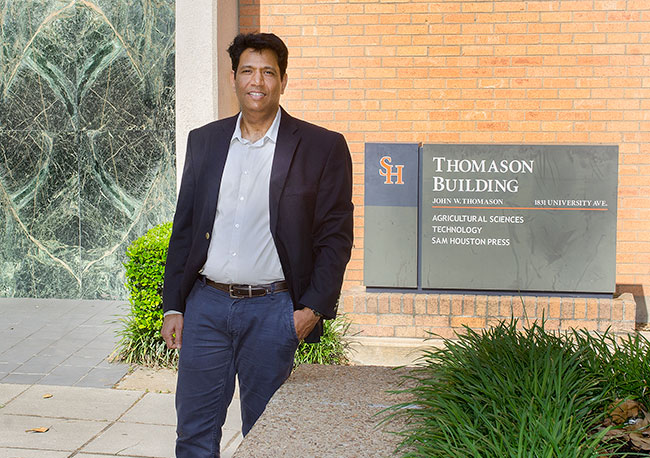 Professor Dixit in front of Thomason Building