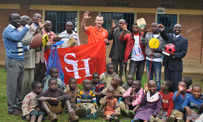 Educators and students in Rwanda posing with Hyman