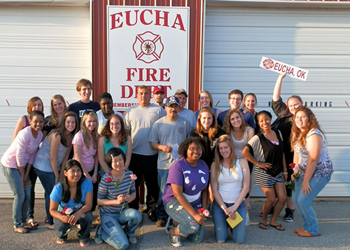 students posing in front of Eucha Fire Department sign