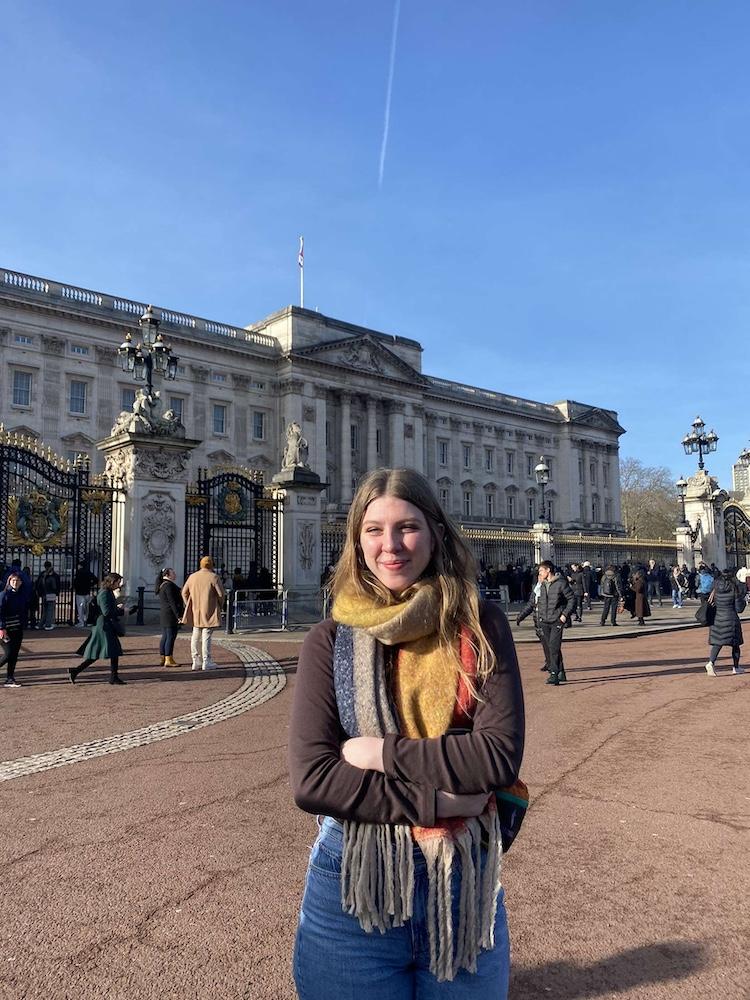 Brady Baker stands outside of Buckingham Palace.
