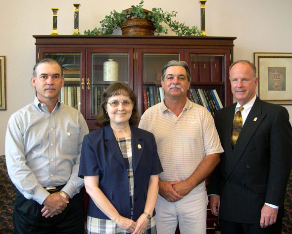 2004 Staff Excellence Award recipients with President Gaertner