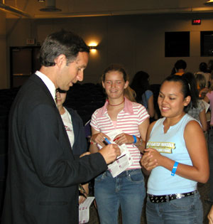 Tuchman signing an autograph